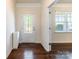 Entryway featuring hardwood floors, a decorative front door and a window at 7711 Kelburn Ln, Charlotte, NC 28273