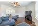 Open-concept living room featuring hardwood floors and plenty of light at 7711 Kelburn Ln, Charlotte, NC 28273