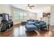 Spacious living room featuring hardwood floors, large windows and comfortable seating at 7711 Kelburn Ln, Charlotte, NC 28273