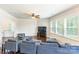 Spacious living room with hardwood floors, ceiling fan and plenty of natural light at 7711 Kelburn Ln, Charlotte, NC 28273