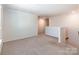 Cozy loft space with neutral carpeting and a bright atmosphere, perfect for relaxing or entertaining at 7711 Kelburn Ln, Charlotte, NC 28273