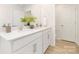Elegant bathroom showcasing a dual vanity with white countertops and wood-look floors at 822 N Naughton St, Chester, SC 29706