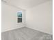 Well-lit bedroom with neutral carpet and a window overlooking a tree at 822 N Naughton St, Chester, SC 29706