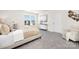 Comfortable bedroom featuring neutral colors, a large window, and plush carpeting at 822 N Naughton St, Chester, SC 29706
