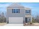 Charming two-story home with gray siding, stone accents and a two car garage at 822 N Naughton St, Chester, SC 29706