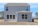 Backyard view of a home with vinyl siding, multiple windows, and a well maintained lawn at 822 N Naughton St, Chester, SC 29706