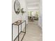 Hallway with a view into the living room, decorated with a mirror and console table at 822 N Naughton St, Chester, SC 29706