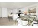 Bright kitchen featuring white cabinetry, a granite countertop island, and a cozy dining area at 822 N Naughton St, Chester, SC 29706