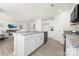 Open kitchen design with white cabinets, granite countertops, and an island overlooking the living area at 822 N Naughton St, Chester, SC 29706