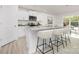 Kitchen featuring white cabinets, stainless appliances and granite counters with bar seating at 822 N Naughton St, Chester, SC 29706