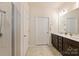 Bathroom features a double vanity with granite countertops and a shower at 8853 Brakeman Dr, Waxhaw, NC 28173