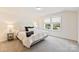 Bedroom with large window, carpet floors and black and white decor at 8853 Brakeman Dr, Waxhaw, NC 28173