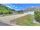 Property showcasing a well-kept lawn, a spacious driveway, and an attached garage at 8853 Brakeman Dr, Waxhaw, NC 28173