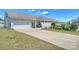 Exterior of property featuring a well-kept lawn, a driveway, an attached garage, and a covered patio at 8853 Brakeman Dr, Waxhaw, NC 28173