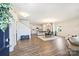 Spacious open-concept living area with hardwood floors, dining area, and a modern kitchen at 8853 Brakeman Dr, Waxhaw, NC 28173