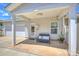 Covered patio with a seating area, offering an ideal space for relaxation and outdoor enjoyment at 8853 Brakeman Dr, Waxhaw, NC 28173