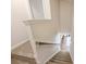 Carpeted staircase with white railing, leading to a lower level at 8853 Brakeman Dr, Waxhaw, NC 28173