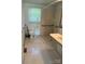 Functional bathroom with a toilet, sink, and accessible shower, focusing on utility at 910 Absher Rd, Statesville, NC 28625