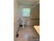 Compact bathroom equipped with essential fixtures, including toilet, sink, and accessible shower at 910 Absher Rd, Statesville, NC 28625