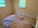 Simple bedroom featuring a window providing natural light, suitable for basic living at 910 Absher Rd, Statesville, NC 28625