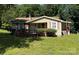 Charming single-story home featuring a quaint porch and well-maintained front yard at 910 Absher Rd, Statesville, NC 28625
