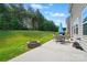 This backyard features a large patio with outdoor seating and a fire pit at 9301 Swimming Dr, Harrisburg, NC 28075