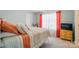 Bedroom featuring stylish bed, bedside table, dresser with television, bright curtains, and closet at 9301 Swimming Dr, Harrisburg, NC 28075