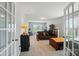 Spacious bonus room with french doors, carpeted floors, neutral paint, and a variety of seating and workspace options at 9301 Swimming Dr, Harrisburg, NC 28075