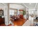 Elegant dining room features hardwood floors, a classic china cabinet, and a chandelier, perfect for entertaining at 9301 Swimming Dr, Harrisburg, NC 28075