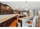 Gourmet kitchen featuring granite counters, stainless appliances, ample cabinet space, and eat-in bar at 9301 Swimming Dr, Harrisburg, NC 28075