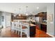 Stylish kitchen with a granite countertops, stainless steel appliances, and breakfast bar seating at 9301 Swimming Dr, Harrisburg, NC 28075