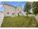 Well-maintained backyard with lush green grass, a privacy fence, and a patio area at 9647 Laurie Nw Ave, Concord, NC 28027