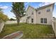Well-maintained backyard with lush green grass, a privacy fence, and a patio area at 9647 Laurie Nw Ave, Concord, NC 28027