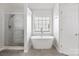 Beautiful bathroom features a garden tub and shower with tile surround at 9647 Laurie Nw Ave, Concord, NC 28027
