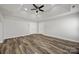 Spacious bedroom with tray ceilings, fan, recessed lights, and neutral wall paint at 9647 Laurie Nw Ave, Concord, NC 28027
