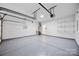 Spacious garage with epoxy floors, shelving, and lots of room for storage at 9647 Laurie Nw Ave, Concord, NC 28027
