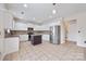 Bright kitchen with stainless steel appliances, granite countertops, tile flooring, and a center island at 9647 Laurie Nw Ave, Concord, NC 28027