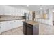 Well-lit kitchen featuring stainless steel appliances, granite countertops, and a center island with dark wood accents at 9647 Laurie Nw Ave, Concord, NC 28027