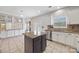 Modern kitchen with stainless appliances, granite counters, central island, and bright natural light from a window at 9647 Laurie Nw Ave, Concord, NC 28027