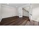Office with French doors leading to the staircase, hardwood floors, and neutral color palette at 9647 Laurie Nw Ave, Concord, NC 28027