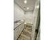 This bathroom features a shower and tub combo and a vanity with granite countertops and hardwood floors at 1050 Beaten Path Rd, China Grove, NC 28023