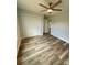 This bedroom features hardwood floors, neutral walls, a ceiling fan, and a closet at 1050 Beaten Path Rd, China Grove, NC 28023