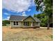 Charming single-story home with a covered porch and a well-manicured lawn in a serene neighborhood at 1050 Beaten Path Rd, China Grove, NC 28023