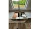 Close-up view of a farmhouse sink with granite countertops and modern faucet, offering style and functionality at 1050 Beaten Path Rd, China Grove, NC 28023