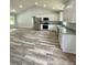 Stylish kitchen with stainless steel appliances, granite countertops, and view into the open living area at 1050 Beaten Path Rd, China Grove, NC 28023