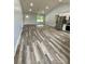 Bright, open living space with vaulted ceilings, modern floors, and stainless steel appliances create an inviting atmosphere at 1050 Beaten Path Rd, China Grove, NC 28023