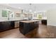 Well-equipped kitchen with a large island, stainless steel appliances, and bright natural light at 10749 Kingsview Dr, Davidson, NC 28036