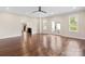 Open-concept living room with hardwood floors and easy access to outdoor areas at 10749 Kingsview Dr, Davidson, NC 28036