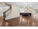 Open-concept living space featuring hardwood floors and seamless flow into the kitchen at 10749 Kingsview Dr, Davidson, NC 28036