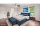 Well-staged primary bedroom with ensuite bath, decor, and natural light at 10749 Kingsview Dr, Davidson, NC 28036